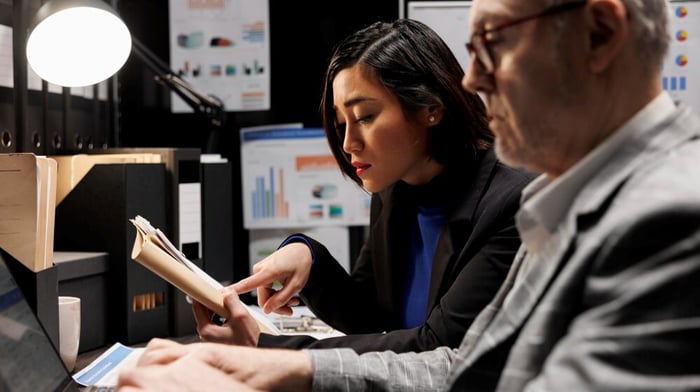 audit professionals working in room